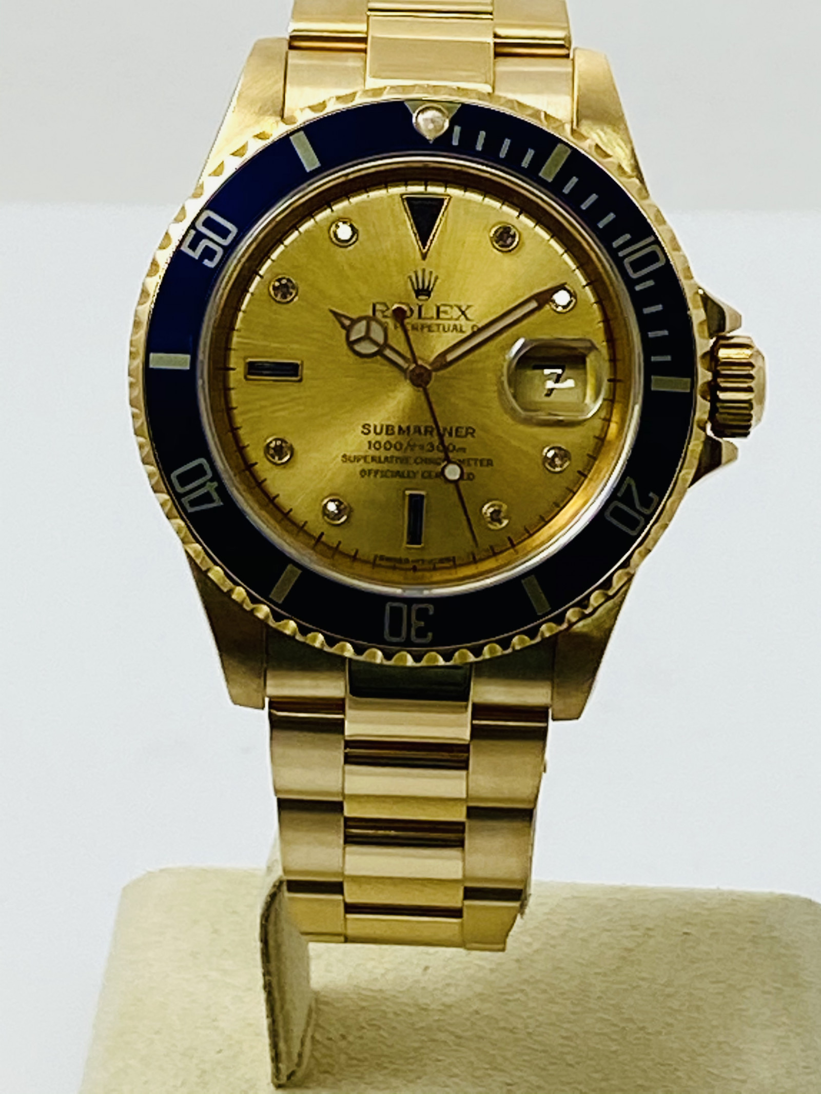 Gold on Oyster Rolex 16618 40 mm Serti Diamond & Sapphire Dial | Ermitage Jewelers